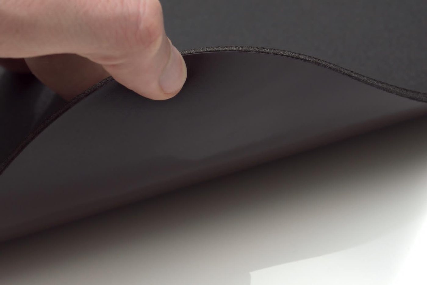 Edge of a black PADS showing the foam thickness